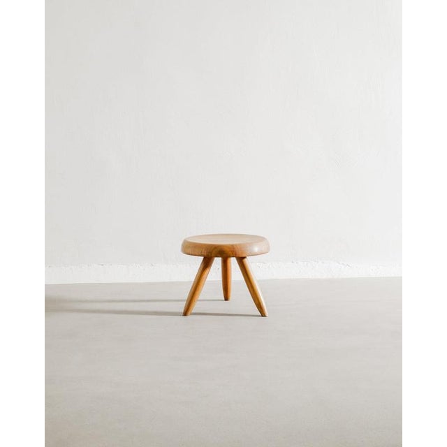 Rare French mid century wooden "Berger" low tripod stool in beatifully patinated cherry wood by Charlotte Perriand for...
