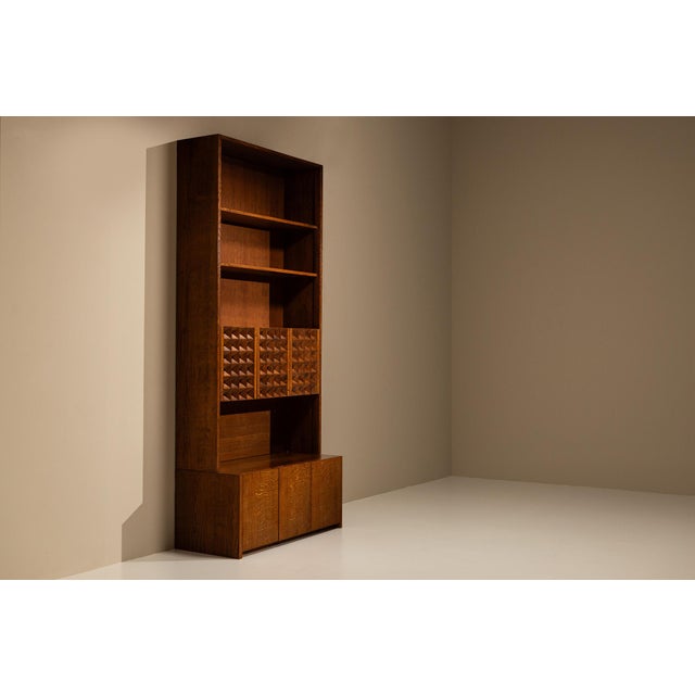 A sense of structure, rhythm and sculptural depth defines this architectural bookcase by Giuseppe Rivadossi. Made from...