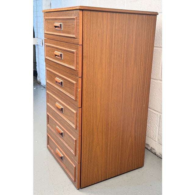 Crafted in the 1960s–70s by Europa, this highboy dresser exemplifies the best of Mid‑Century Modern design—clean lines,...