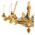 An empire style eight light chandelier featuring a dark green tole bowl accented with richly detailed gilt bronze mounts....