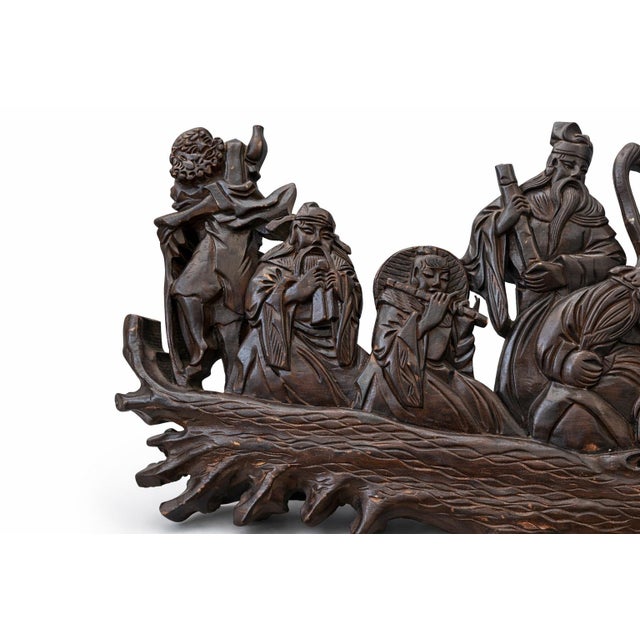 Intricately hand-carved hardwood wall panel depicting the legendary Eight Immortals, presented in a richly detailed,...