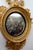 This is an exceptional 19th century water-gilded Continental convex mirror with a bold, prominent eagle situated above a...