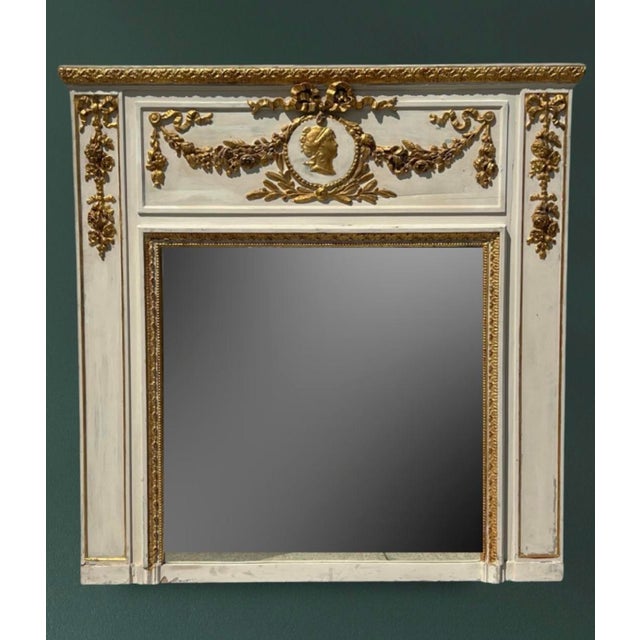 19th Century French Transition Period Neoclassical Trumeau Mirror in the Louis XVI Style Elegant and richly detailed, this...