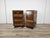 A pair of distinctive bedside tables with soft lines and slightly rounded edges, from the Art Deco period of the early...