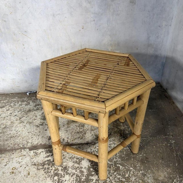 A charming mid-century bamboo hexagonal side table, featuring a distinctive six-sided design, natural honey-coloured...
