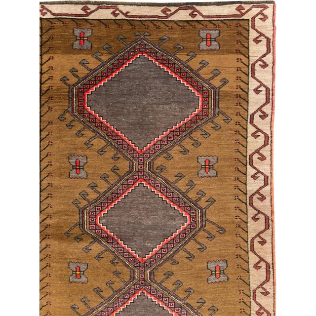 A vintage Turkish Anatolian tribal room size carpet handmade during the Mid-20th Century. Measures: 9' 11" x 12' 10".