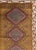 A vintage Turkish Anatolian tribal room size carpet handmade during the Mid-20th Century. Measures: 9' 11" x 12' 10".