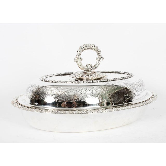 This is an exquisite and rare antique pair of English silver plated entree dishes, bearing the cross arrow mark of T & J...