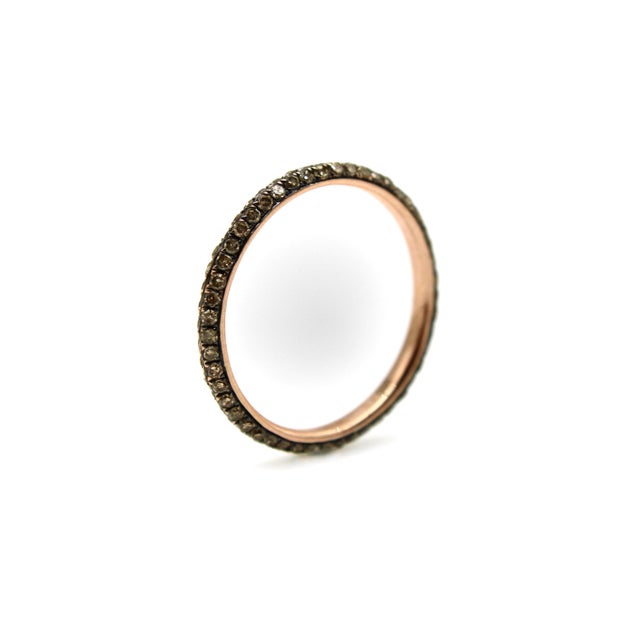 This vintage micro pave diamond eternity band was made by 9SQ circa 2010. It’s made of 10k gold and features 98 bead set...