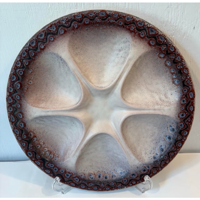 Very unique and heavy purple and cream oyster plate. I have four of these available.