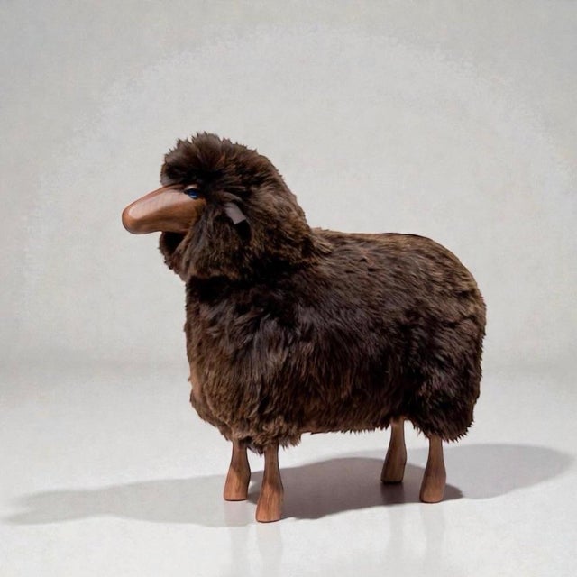 Equal parts iconic and adorable, this large life-sized Lalanne-style sheep is made of wood with leather ears and brown...