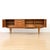 Designed and manufactured by Stonehill Furniture in England in 1960, this elegant mid-century sideboard embodies the...