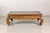 This vintage Chinese low kang coffee table features a sculptural silhouette inspired by traditional northern Chinese...