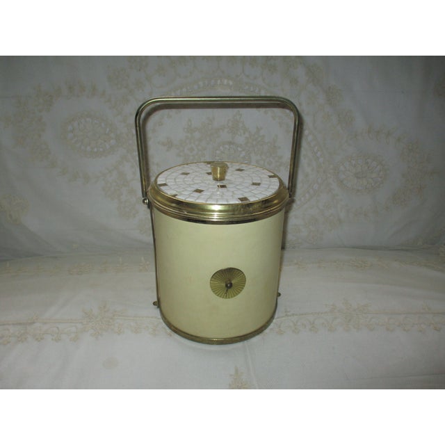 This is a Beautiful! Vintage 1960s Mid Century Modern Retro Ice Bucket with a Cream Center with Brass Medallions on front...