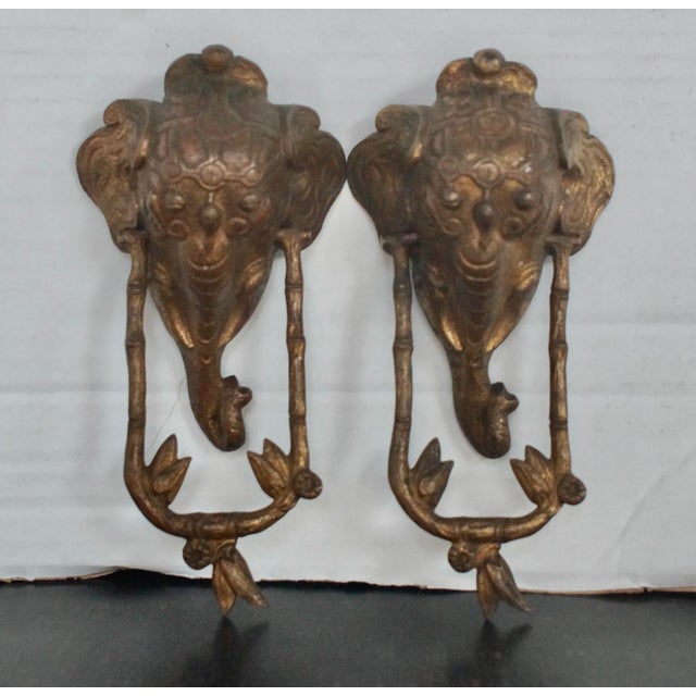 A Superb Pair Of Antique Brass elephant door knockers. Made from pressed Brass, this pair of elephant door knockers have a...