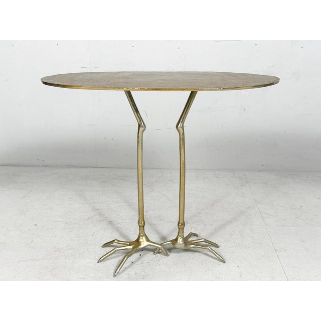 Sculptural coffee table in the style of Meret Oppenheim, France, 1980s, construction made of brass in a gold color,...