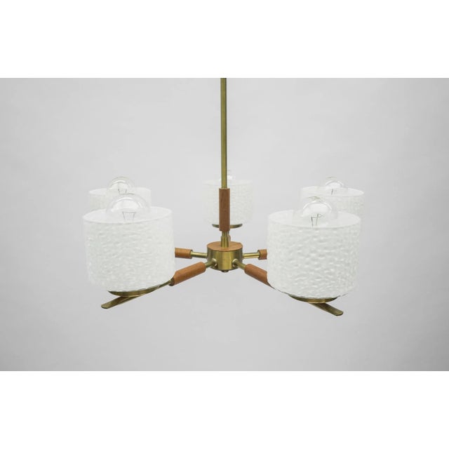 Rare swedish brass lamp with white glass shades, 1960s. executed in milk glass, teak wood, brass and metal. The lamp needs...