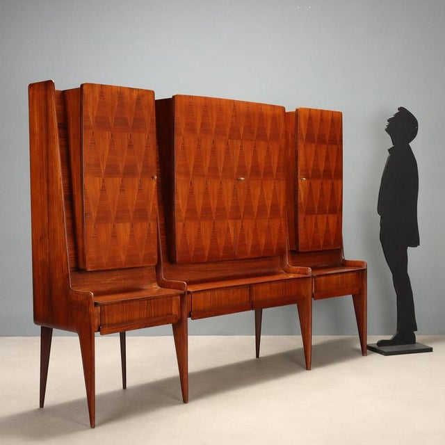 1950s Italian-made living room cabinet, featuring refined veneer with geometric patterns that add a distinctive and...