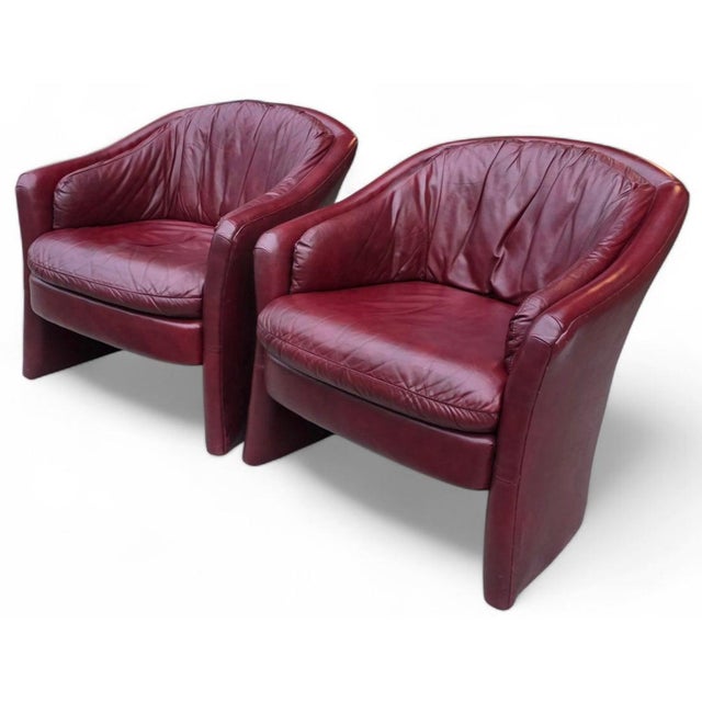 Featured is a Pair of Vintage Oxblood Leathercraft Postmodern Lounge/Club Chairs. These chairs boast a sculptural, rounded...