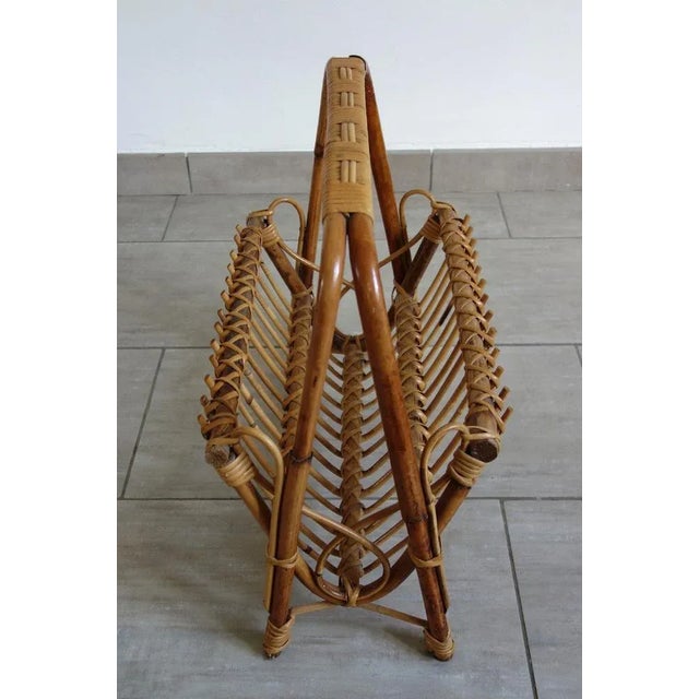 Bamboo and rattan rack of the middle of the last century in the style of the creations of Franco Albini.