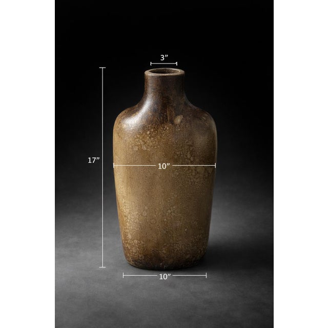 A large-scale studio pottery vessel with a rich earth-tone glaze and subtle dragonfly etching—an organic, sculptural...