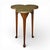A fmid-20th century trefoil side or drinks table in solid mahogany having a clover-form top of olive green leather tooled...