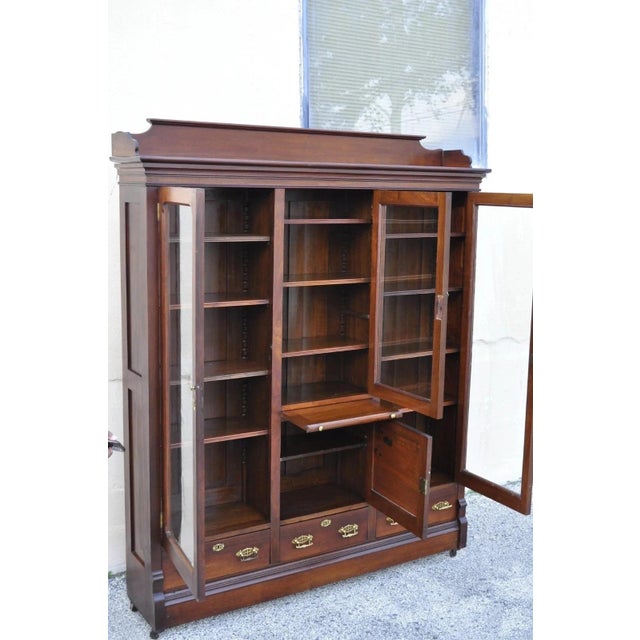 Victorian Antique Eastlake Victorian Walnut Wavy Glass Triple Bookcase Display Cabinet For Sale - Image 3 of 13