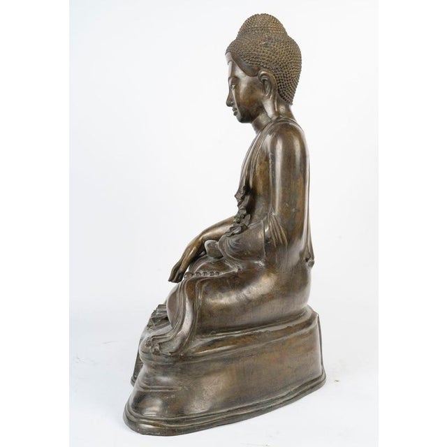 Late 19th-century patinated bronze seated Buddha, Burma. 19th-century patinated bronze seated Buddha, Kingdom of Mandalay,...