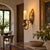 This vintage brass sconce has a warm, aged character that reflects the charm of traditional lighting from another era. Its...