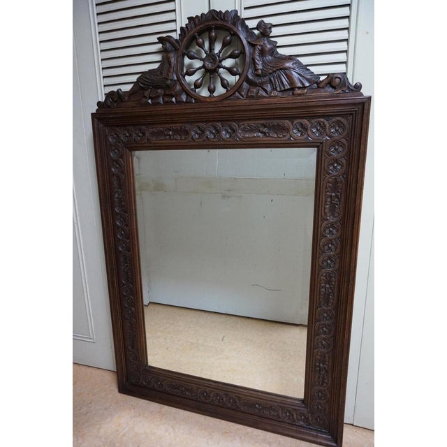 Bretton Quimper carved oak mirror. French Folk art hand made in the region of the Bretagne. The mirror has a bevelled edge...