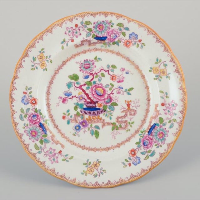 Ashworth, England. Set of six plates in faience. Chinese style. Decorated with flowers. Late 19th century. Marked. In...