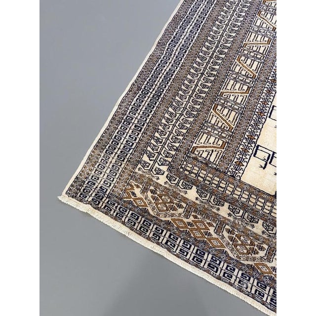 This hand-knotted Iranian Yazd rug features a sophisticated color palette of ivory and subtle off-grey tones. Designed...