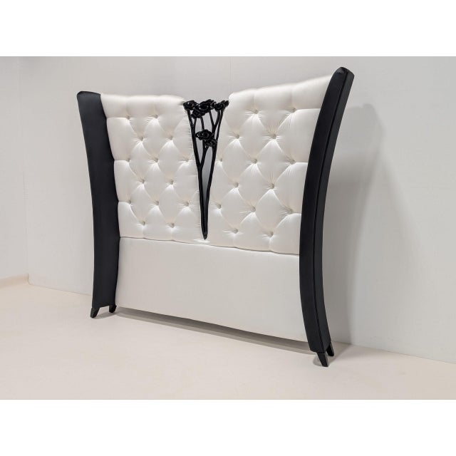 A spectacular bed featuring christopher’s signature hand-carved camelia, perfectly complemented by the sumptuous tufted...