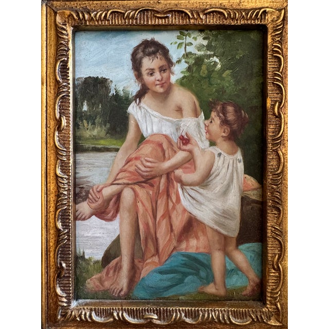 Late 19th to early 20th century French oil on wood panel depicting a young woman and child seated beside a tranquil...