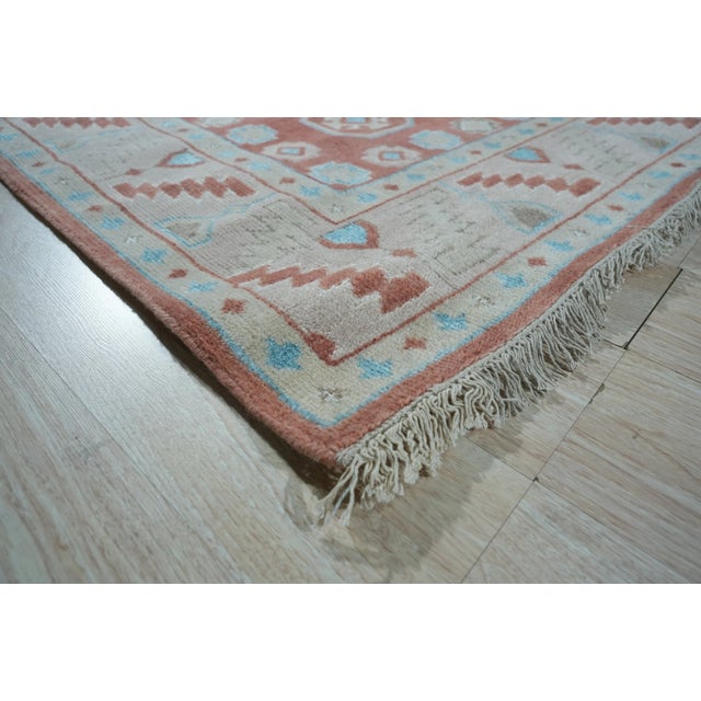 Penelope Traditional Coral Hand Knotted Wool Rug, Country of Origin: India. This exceptional piece showcases a dense,...
