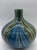 Striking and vibrant, this vintage Murano-style hand blown art glass vase features a beautiful swirl pattern in rich blue,...