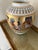 Bring the timeless allure of Egyptomania into your space with this striking limited-edition porcelain vase from renowned...