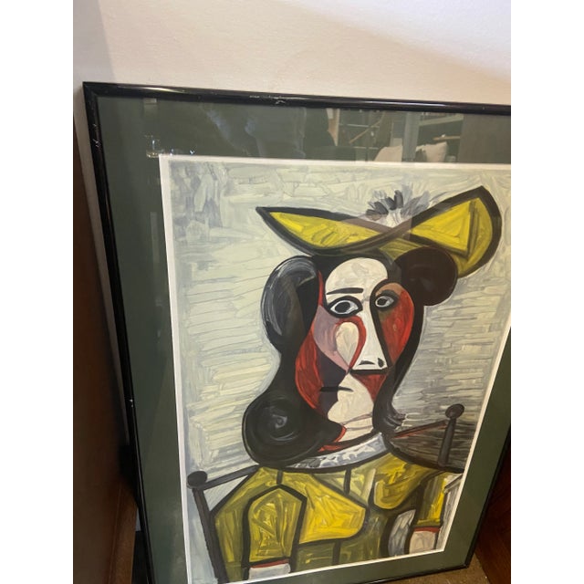 Framed and matted Picasso lithograph portrait de Femme Au Chapeau Et A La Robe Vert Jaune from the Marina Picasso...