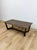 This vintage style coffee table from Williams Sonoma Home showcases a rich dark walnut finish with clean, tailored lines...