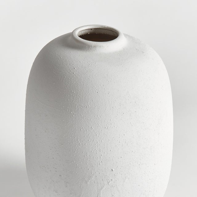 This modern cylinder style vase is perfect for the single statement branch. Made of highfired stoneware and a coldfinish...