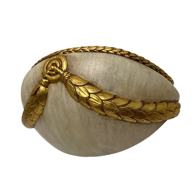 A 1960s wall lamp made of cream-coloured ceramic with a gold-coloured garland. The size is quite large (width 13.4...