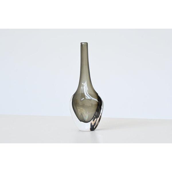 Beautiful black glass vase “Sommerso” designed by Nils Landberg for Orrefors, Sweden 1950. This striking black glass...