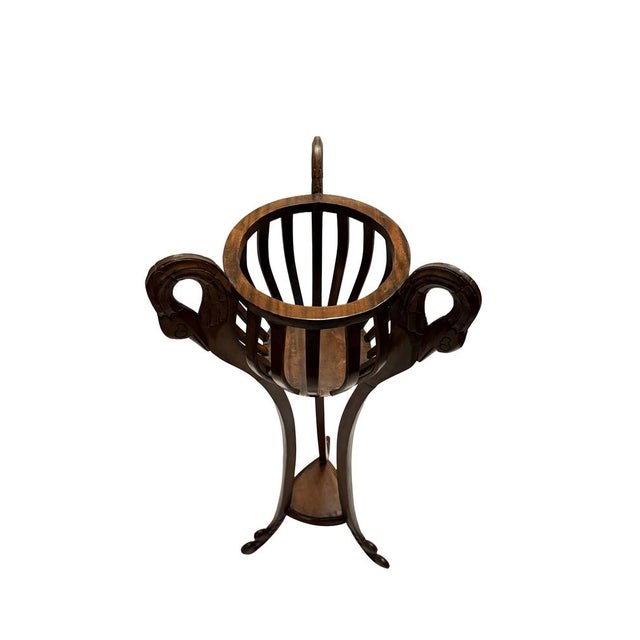 This jardinière stand reflects the enduring influence of early 19th-century Regency design, reinterpreted through...