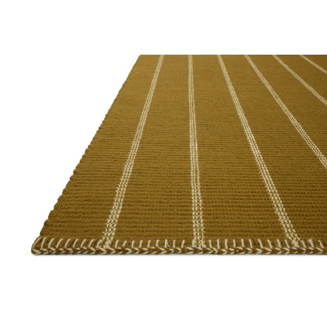 The Harlan Collection by Amber Lewis x Loloi is a classic striped flatweave area rug in the interior designer’s signature...