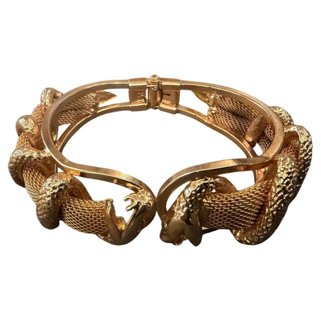 This striking 21st-century Italian snake bangle bracelet is a masterclass in bold, sculptural jewelry design, capturing...
