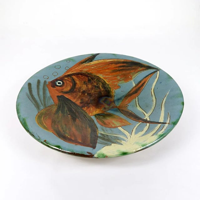 Very colorful and decorative wall plate with a stylized fish. Designed and made by Puigdemont of Spain. The plate has a...