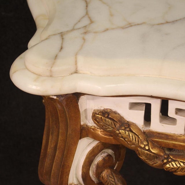 French console from the second half of the 20th century. Furniture in wood and plaster in the Louis XV style, carved,...