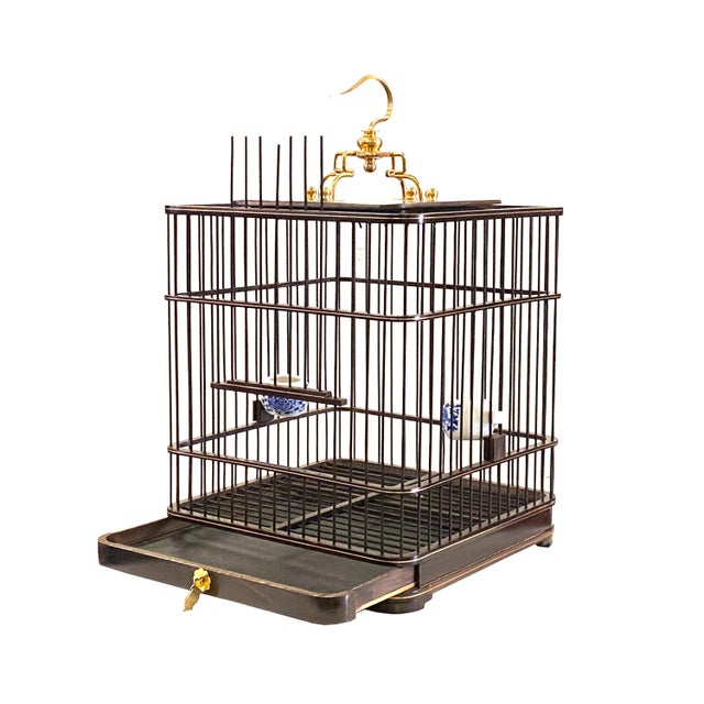This is a nice handmade decorative collectible birdcage in good quality solid wood. It has a dark brown body decorated...