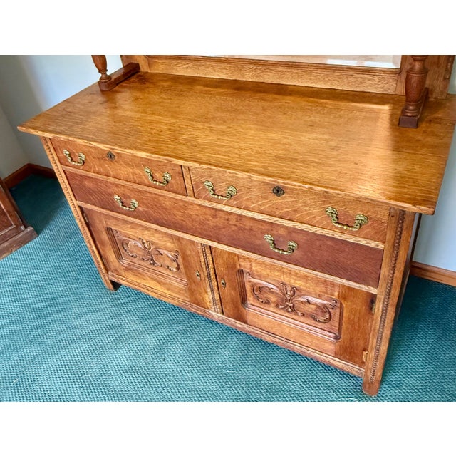Beautiful late 19th century sideboard constructed from quarter sawn oak with carved door panels, beaded trims, three...