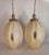 Enormous pair of 1960's swag pendant lamps. Stretched cloth over a steel frame with a scalloped brass cap. Shade with cap...
